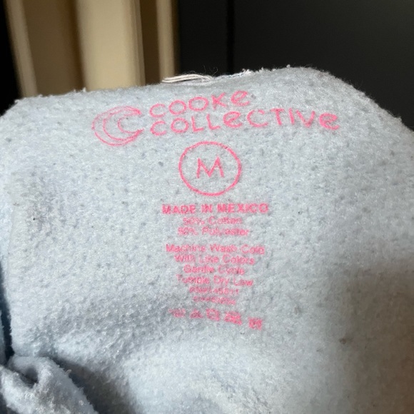 Psychedelic baby blue hoodie with pink writing - Picture 3 of 3